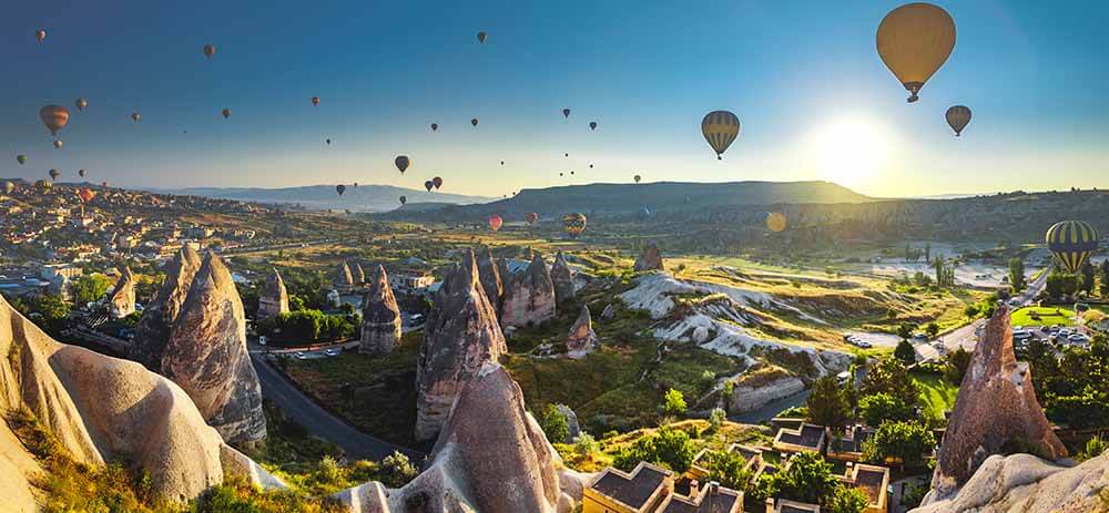 Hot air balloon flying over spectacular Cappadocia.